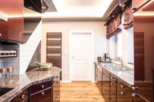 a kitchen with a sink and a counter top at Villa 10 in Oetz