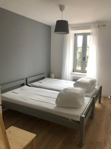 Ένα ή περισσότερα κρεβάτια σε δωμάτιο στο Les gîtes du paradis