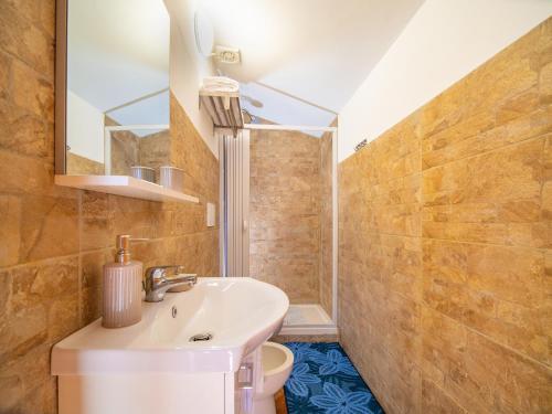 a bathroom with a sink and a toilet at Terrazza Santa Chiara in Assisi