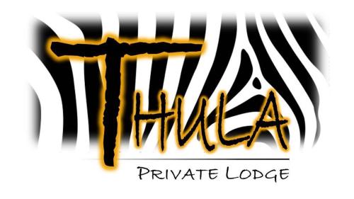 - un panneau pour un lodge privé avec un zèbre dans l'établissement Thula Private Lodge, à Phalaborwa