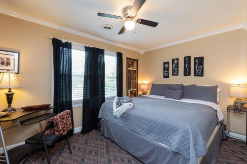 a bedroom with a bed and a desk and a window at Executive 4bdr Country Getaway-Bachelor(ette) Wedding Parties Welcome in Nashville