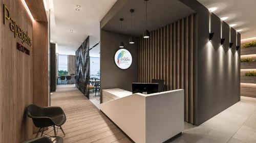an office with a reception desk and a chair at Hotel Papagalos in Neos Marmaras