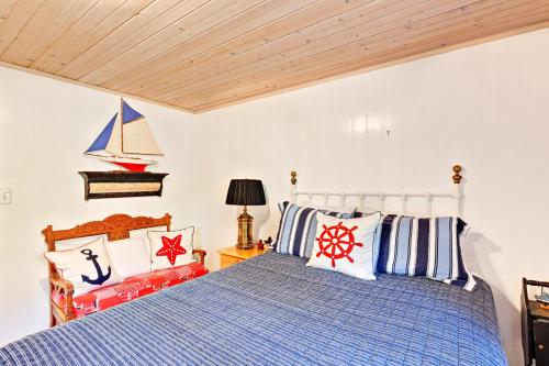 a bedroom with a bed and a boat on the wall at Generations in Douglas