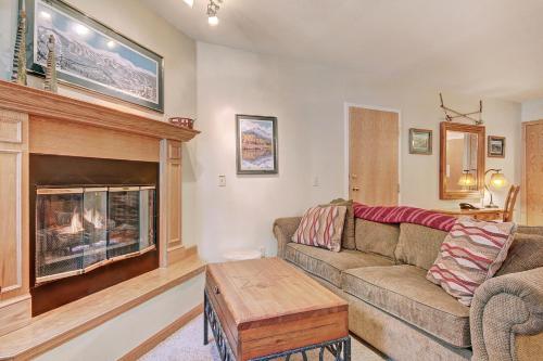 a living room with a couch and a fireplace at One-Bedroom Apartment in Breckenridge