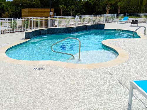 a small swimming pool with blue water at Seaside RV resort in Seabrook