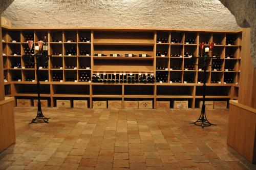 a wine cellar with shelves of wine bottles at Chateau Herálec Boutique Hotel & Spa by L'Occitane in Herálec