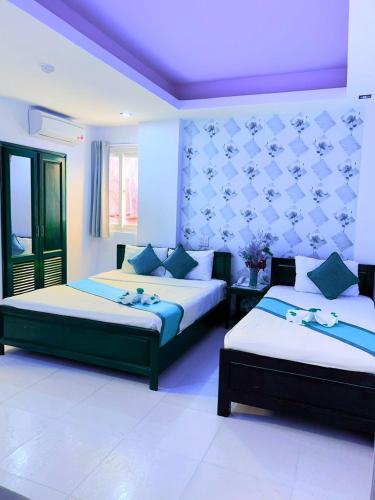 Cama o camas de una habitación en Ha Anh Hotel - Mui Ne