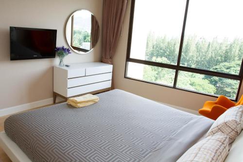 Marakesh Hua Hin Sea View tesisinde bir odada yatak veya yataklar