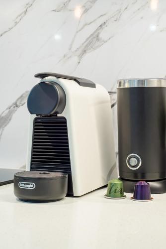 a toaster sitting on top of a counter at Immaculate Apartment close to Brisbane City and Airport in Brisbane