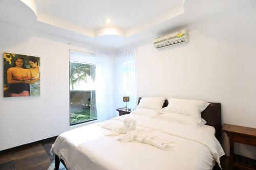 Phangan Luxry Beach Villaにあるベッド