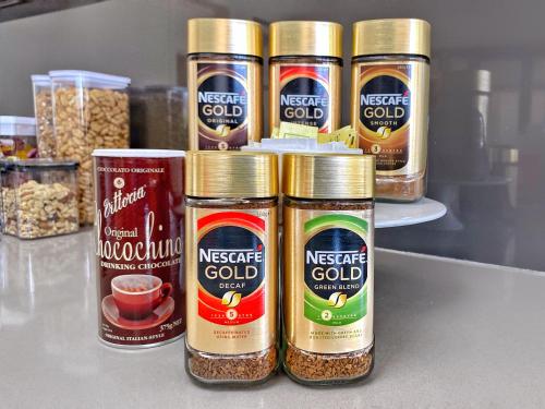 a group of four jars of nuts and seeds at Commercial Motel in Hay