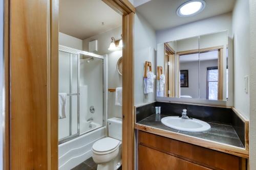 a bathroom with a sink and a toilet and a mirror at Mt Bachelor Village Ski House # 262 in Bend