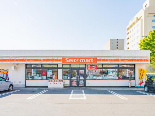 a sears mart store in a parking lot at Hotel Grand Terrace Obihiro in Obihiro
