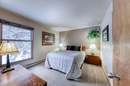 a bedroom with a bed and a window at Mt Bachelor Village Ski House # 262 in Bend