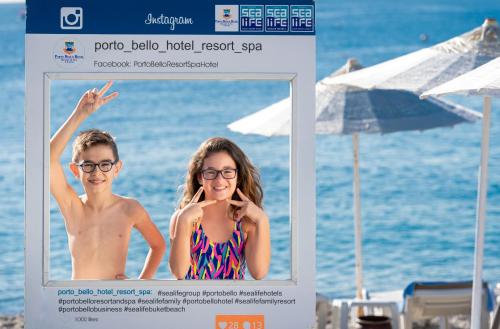 a picture of a boy and a girl on the beach at Porto Bello Hotel Resort & Spa in Antalya