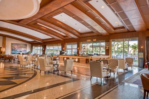 a large room with chairs and a bar at Porto Bello Hotel Resort & Spa in Antalya
