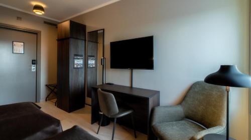 Quality Hotel Panoramaにあるテレビまたはエンターテインメントセンター
