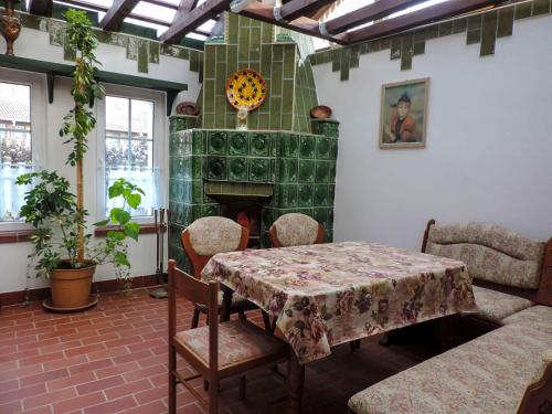 a dining room with a table and a fireplace at Stilvolles Ferienhaus Artdeco in Wernigerode