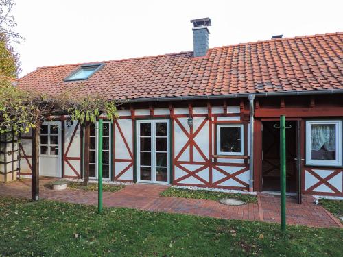 a red and white house with a red roof at Stilvolles Ferienhaus Artdeco in Wernigerode