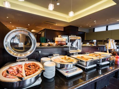 a buffet line with many different types of food at Hotel Grand Terrace Obihiro in Obihiro