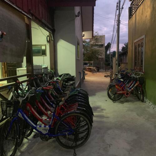 a row of bikes parked next to a building at Dalom Guesthouse in Don Det