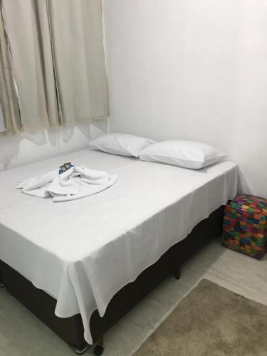 Ένα ή περισσότερα κρεβάτια σε δωμάτιο στο Pousada Anjos da Montanha