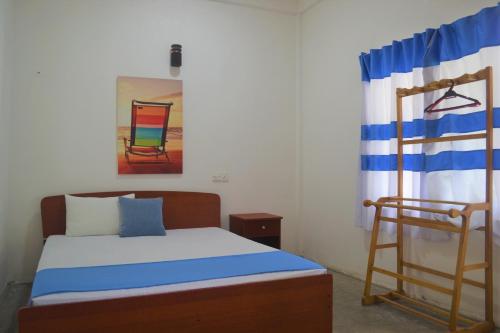Ein Bett oder Betten in einem Zimmer der Unterkunft D'Villa Garden House