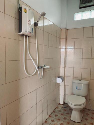 a bathroom with a toilet and a shower at Dalom Guesthouse in Don Det