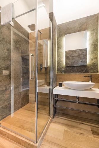 a bathroom with a sink and a mirror at B-STAY Via Milano 52 in Rome