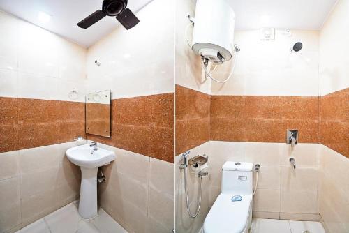 a bathroom with a shower and a toilet and a sink at HOTEL KAMALA PALACE , Agra in Agra