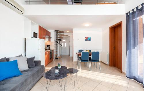 a living room with a couch and a table at Oliva Holiday Apartment in Banjole