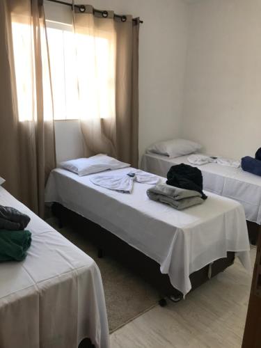 Ένα ή περισσότερα κρεβάτια σε δωμάτιο στο Pousada Anjos da Montanha