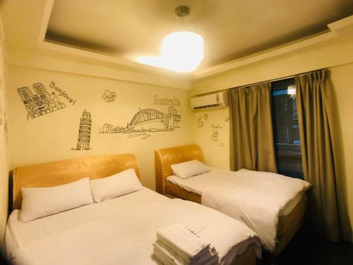Postel nebo postele na pokoji v ubytování Love Feng Jia Apartment Hotel
