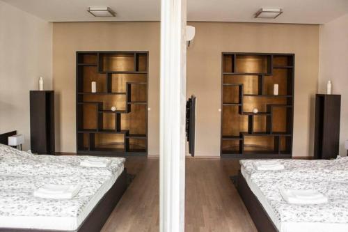 En eller flere senge i et værelse på Apartment Downtown Ulloi 3