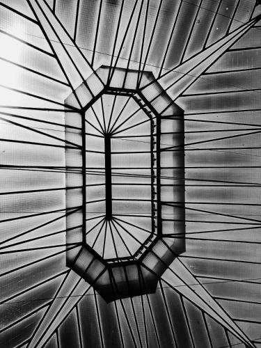 a black and white photo of a ceiling at Planeta Cadiz Hostel in Cádiz
