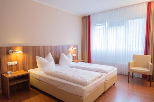 Das Ebertor - Hotel & Hostelにあるベッド