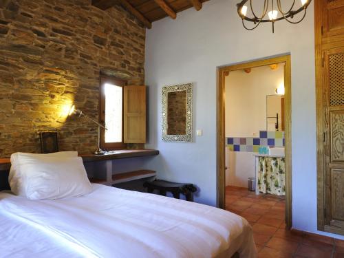 מיטה או מיטות בחדר ב-Finca Las Abubillas