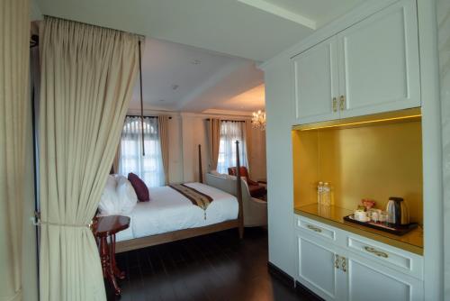 Letto o letti in una camera di Nanta Glam CM Hotel & Residences