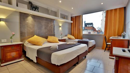 Cama ou camas em um quarto em Hotel Giolitti Smart