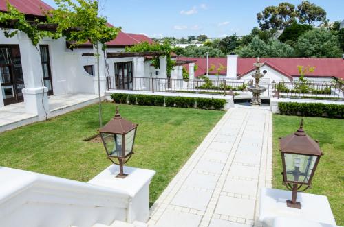 Κήπος έξω από το Homestead Villas