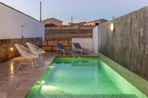 a swimming pool on the roof of a house at Viles Can Moreno in Ses Salines