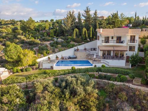 an aerial view of a house with a swimming pool at Villa HERMIONA in Kouklia