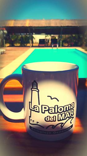 a coffee cup with a picture of a lighthouse on it at La Paloma del Mar in La Paloma