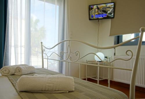 โทรทัศน์และ/หรือระบบความบันเทิงของ Villa Castellina & Emmanouela holiday apartment