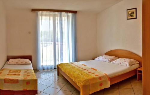 Postel nebo postele na pokoji v ubytování Apartments Iko