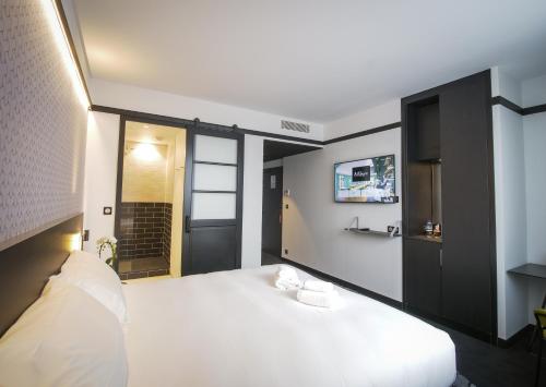 Katil atau katil-katil dalam bilik di Le Magic Hôtel & Spa