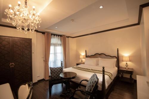 Letto o letti in una camera di Nanta Glam CM Hotel & Residences