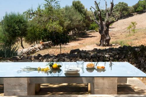 a table with bowls of fruit on top of it at Finca Pessal in Caʼs Concos