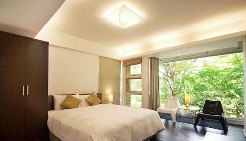 Posteľ alebo postele v izbe v ubytovaní Ming Shan Villa