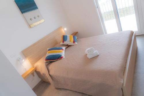 מיטה או מיטות בחדר ב-Villa Triona Marzamemi con Piscina